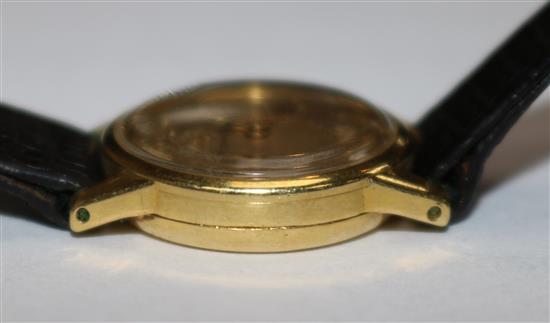 A ladys 1950s 18ct gold Omega manual wind wrist watch.